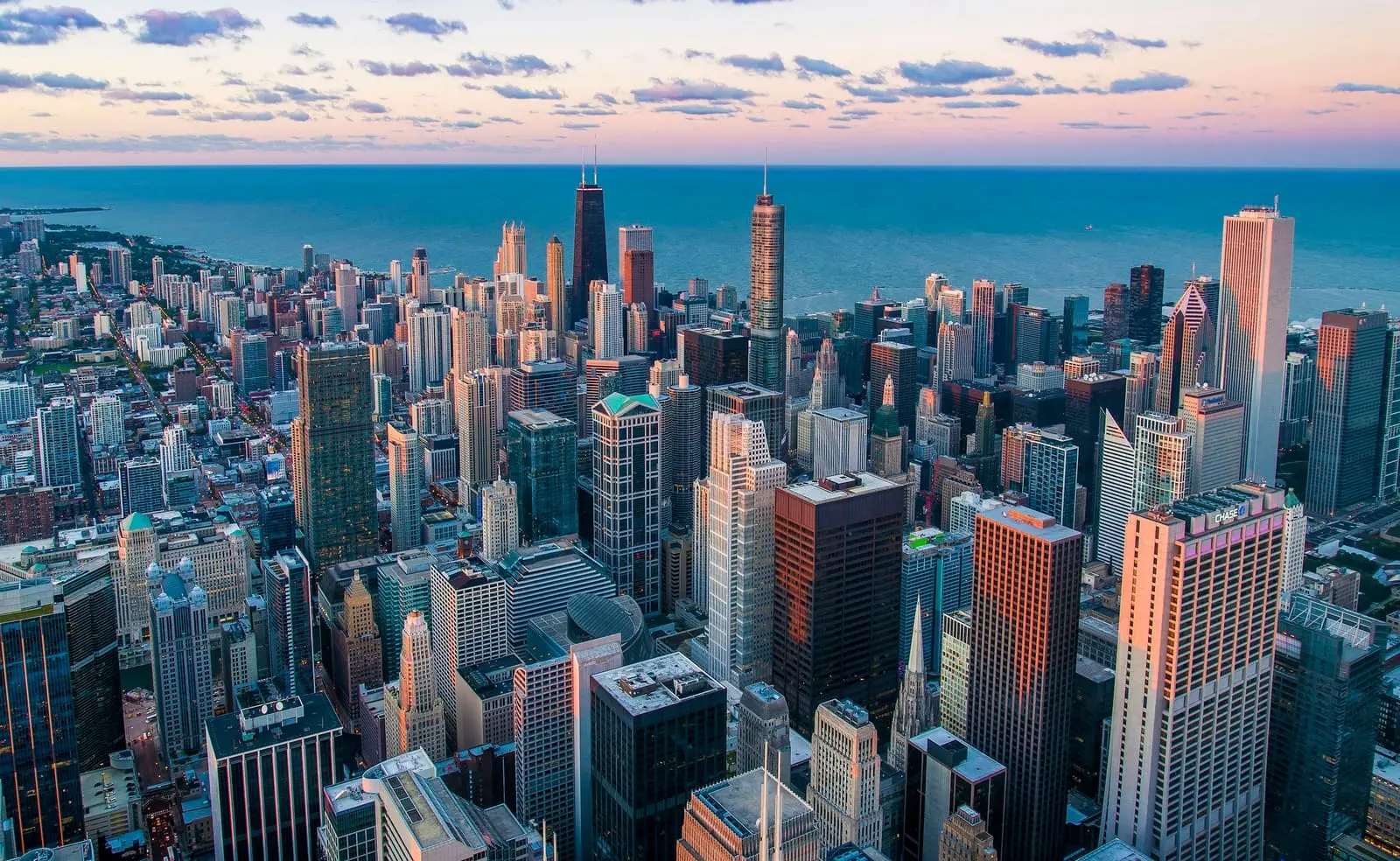 Aerial view of a city's downtown towers beside a lake