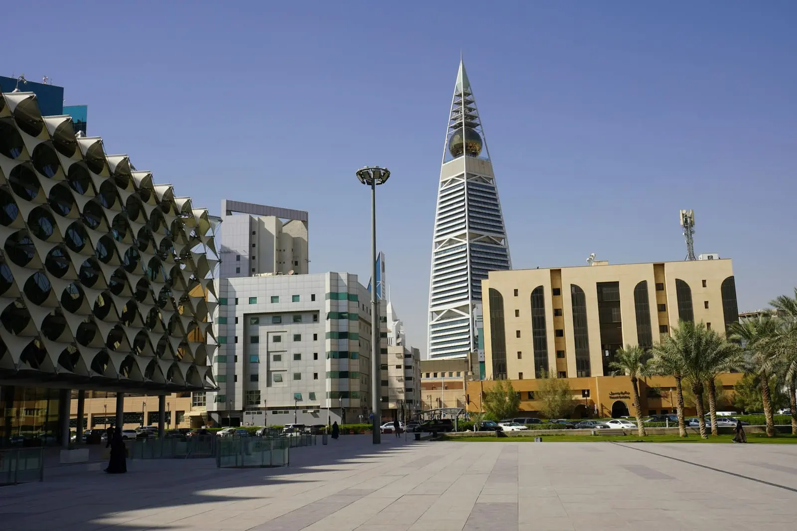 Modern towers rising above a paved plaza in Riyadh under a clear sky
